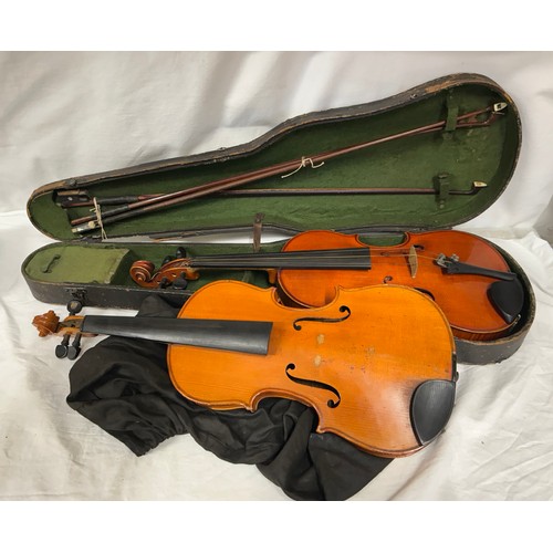 951 - A 19thC cased violin, no labels, back measures 37cm together with another violin and three bows.