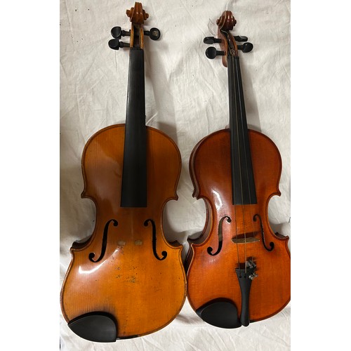 951 - A 19thC cased violin, no labels, back measures 37cm together with another violin and three bows.