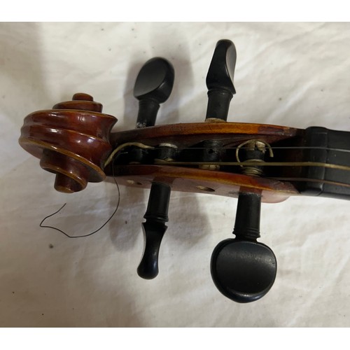 951 - A 19thC cased violin, no labels, back measures 37cm together with another violin and three bows.