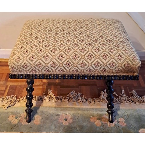 92 - A 19thC upholstered stool on bobbin turned legs. 44cm h x 55cm w x 45cm, d.