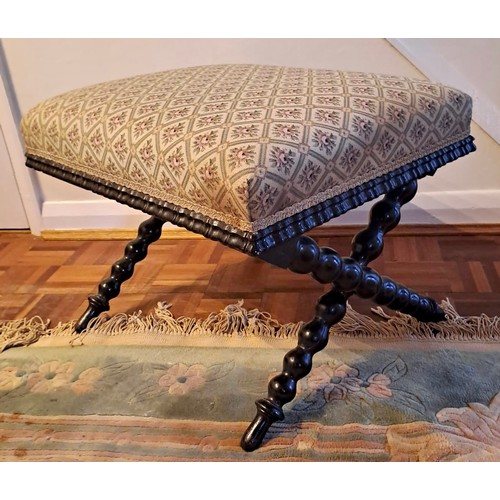 92 - A 19thC upholstered stool on bobbin turned legs. 44cm h x 55cm w x 45cm, d.