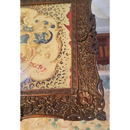 93 - A 19thC pedestal table, cross stitch embroidery to top with intricately carved frame. 61cm h x 60cm ... 