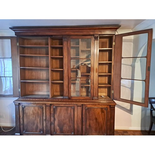 94 - A 19thC mahogany bookcase with three doors to base and three glazed doors above. 240cm h x 214cm w x... 