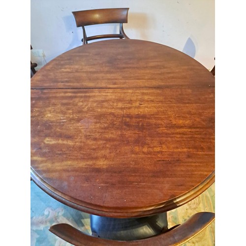 96 - A 19thC mahogany circular dining table 75cm h x 160cm w x 137cm d together with six bar back mahogan... 