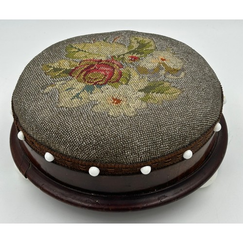 1248 - Two Victorian circular footstools with bead work and tapestry on ceramic bun feet 29cm d, together w... 