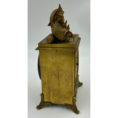 997 - A French gilt 19thC mantle clock 26cm h x 14cm h x 11cm deep. With key.