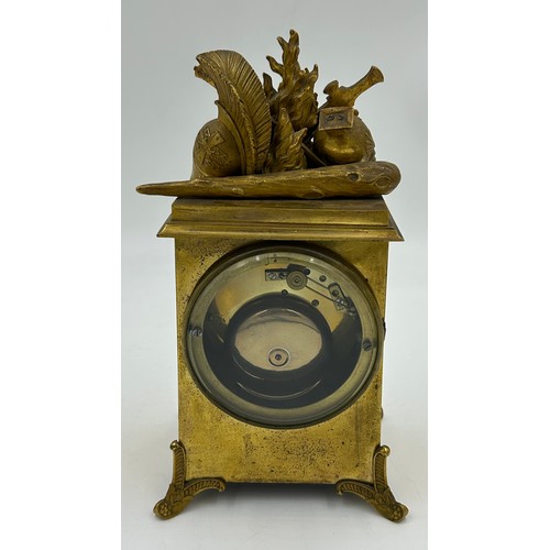 997 - A French gilt 19thC mantle clock 26cm h x 14cm h x 11cm deep. With key.