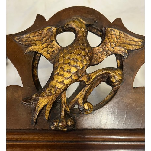 1025 - Two 19thC mahogany fretwork mirrors with the largest having a carved griffin at the top edge and she... 