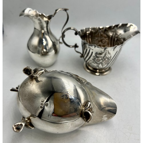 846 - Three hallmarked silver jugs. Total weight 224gm. Comprising Birmingham, date letter rubbed, London ... 