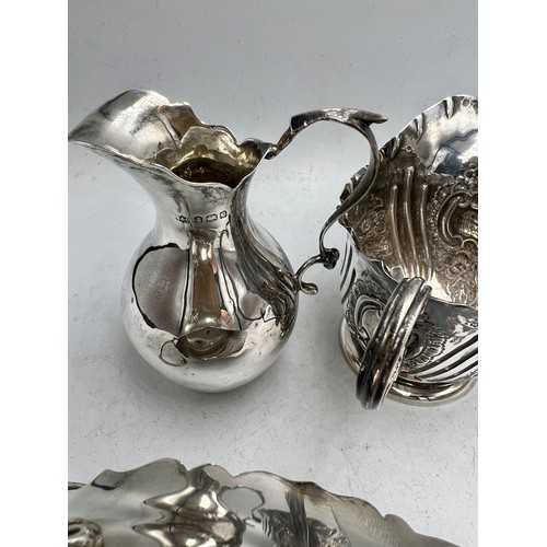 846 - Three hallmarked silver jugs. Total weight 224gm. Comprising Birmingham, date letter rubbed, London ... 