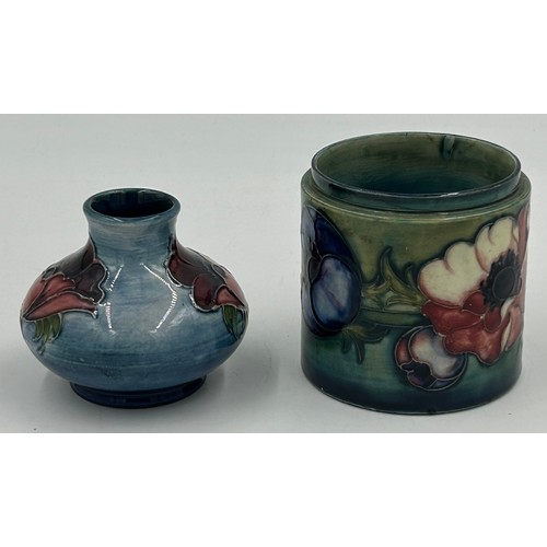 466 - Moorcroft, two pieces of anemone design to include a 1950's  pot lacking lid and a small squat vase ... 