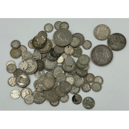 748 - A collection of mainly UK coinage comprising of 112 Elizabeth II Crowns, a glass bottle of post 1947... 