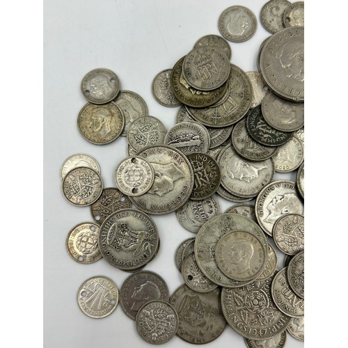 748 - A collection of mainly UK coinage comprising of 112 Elizabeth II Crowns, a glass bottle of post 1947... 