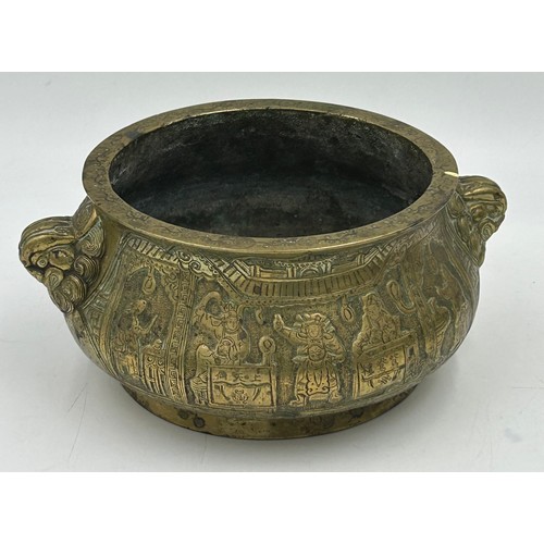 906 - Various items to include a cast bronze Buddha head, a heavy Chinese brass bowl with dragon dog mount... 