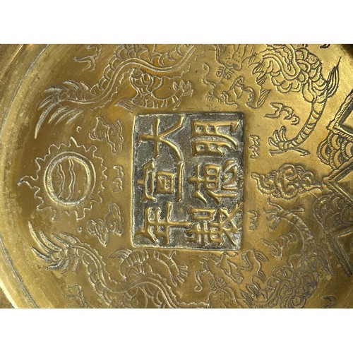 906 - Various items to include a cast bronze Buddha head, a heavy Chinese brass bowl with dragon dog mount... 