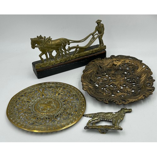 906 - Various items to include a cast bronze Buddha head, a heavy Chinese brass bowl with dragon dog mount... 