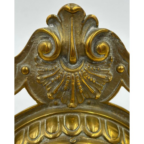 998 - A brass easel mantel clock with ceramic face 8.5cm d and roman numerals.  Movement marked SF and GB ... 