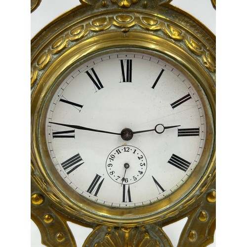 998 - A brass easel mantel clock with ceramic face 8.5cm d and roman numerals.  Movement marked SF and GB ... 