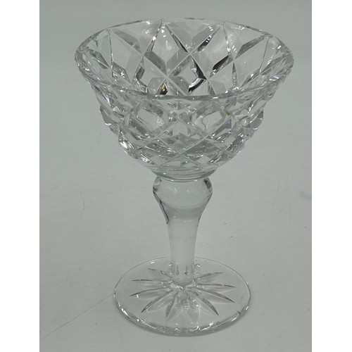 503 - A set of eight cut glass flutes with a swirl design 27.5cm h, seven fine flutes with faceted sides 2... 