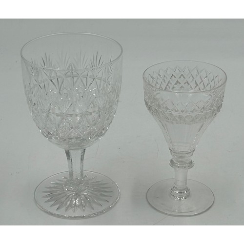 503 - A set of eight cut glass flutes with a swirl design 27.5cm h, seven fine flutes with faceted sides 2... 