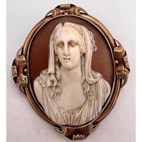 673 - A 19thC carved shell cameo brooch set in unmarked yellow metal, weight 15.1gm, 5cm x 4.5cm, together... 