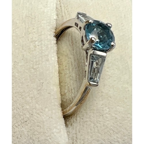 676 - A QVC nine carat gold ring set with central blue stone. Size N. Weight 1.9gm.