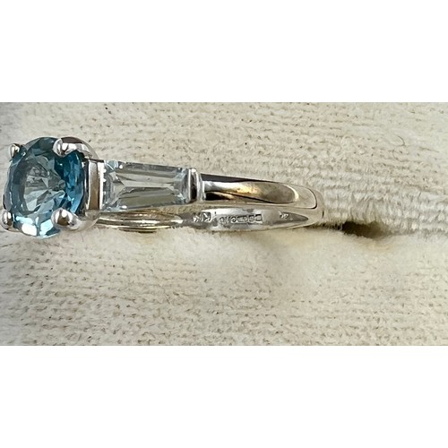 676 - A QVC nine carat gold ring set with central blue stone. Size N. Weight 1.9gm.