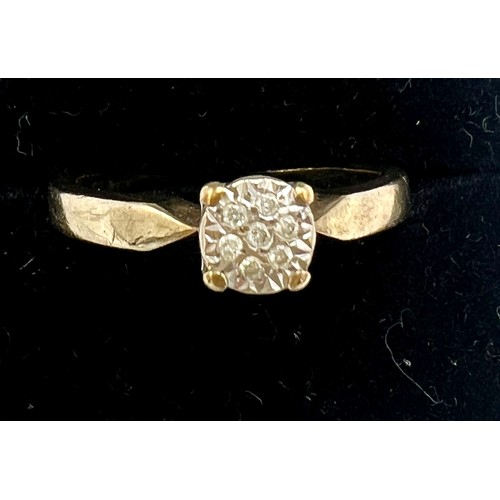 678 - A nine carat gold ring set with seven clear stones. Size M/N. Weight 2.7gm.