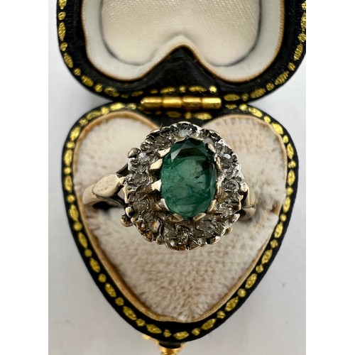 681 - A 9 carat gold gem set cluster ring, the central green stone surrounded by clear stones. Size M. Wei... 