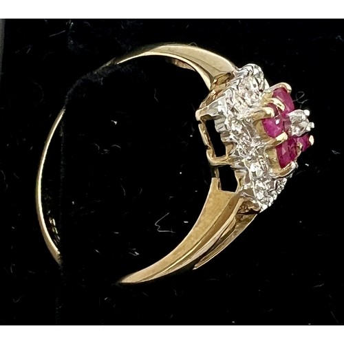 686 - A nine carat gold ring set with clear and pink stones. Size P. Weight 2.1gm.