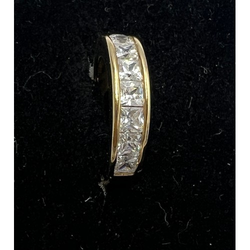 688 - A 9 carat gold ring set with cubic zirconia. Size K. Weight 3.1gm.