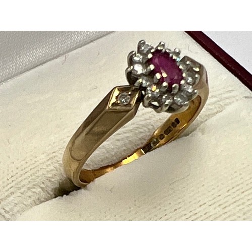 689 - A 9 carat gold cluster ring set with pink and clear stones. Size N. Weight 3gm.