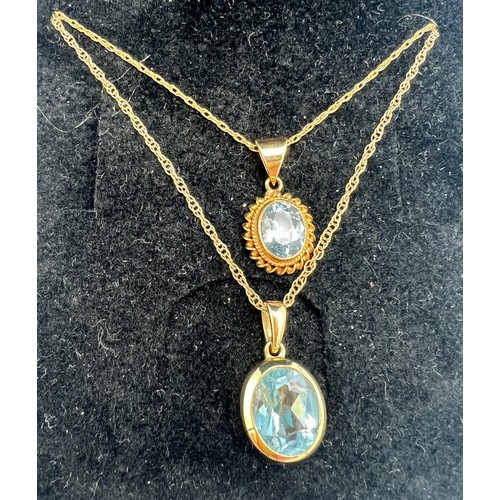 692 - Two 9 carat gold blue stone pendants. Chains 47cm l. Total weight 4.3gm.