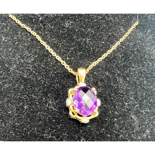 697 - A 9 carat gold amethyst and diamond set pendant on a nine carat gold chain. Total weight 2.9gm.