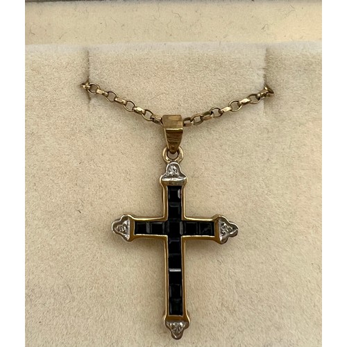 698 - A 9 carat gold gem set crucifix, 2.5cm x 2cm approximately, on a 9 carat gold chain. Total weight 3.... 