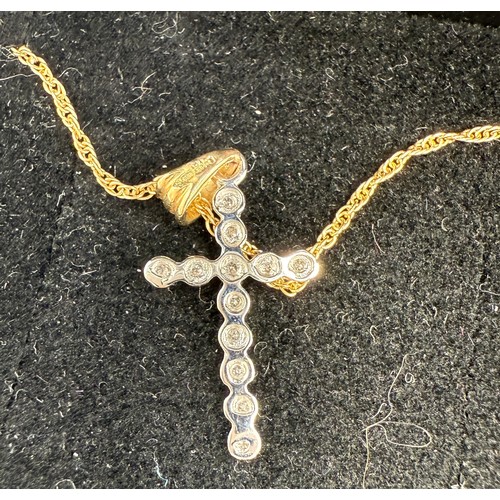 699 - Nine carat gold chain and two 9 carat gold gem set crucifix, 2.2gm, together with a silver gem set c... 