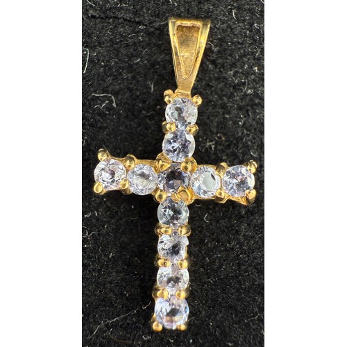 699 - Nine carat gold chain and two 9 carat gold gem set crucifix, 2.2gm, together with a silver gem set c... 