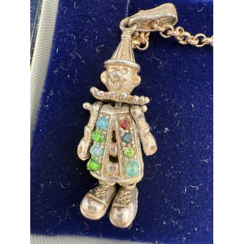 699 - Nine carat gold chain and two 9 carat gold gem set crucifix, 2.2gm, together with a silver gem set c... 