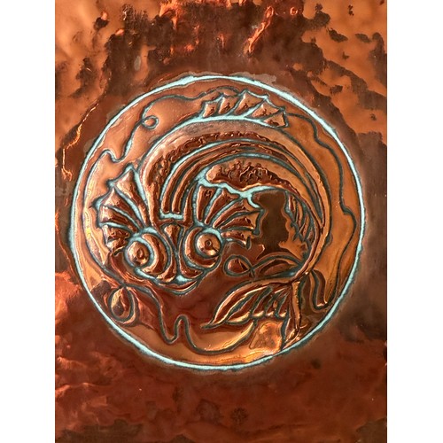 1026 - An Arts and Crafts Newlyn style hammered copper wall mirror with fish and shell design. 46 x 28cm.