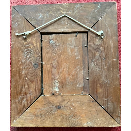 1027 - An Arts and Crafts copper wall mirror with grape design. 40 x 36cm.