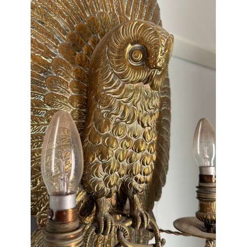 977 - A good quality brass wall mounted owl with electrified candle holders supported by snakes clutched i... 