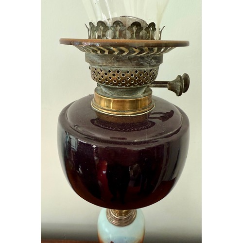 980 - Brass and ceramic oil lamp with silver mounts. 46cm h.