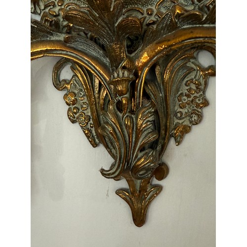 1028 - A 19thC brass framed wall mirror with candle sconces. 41 h x 35cm w.