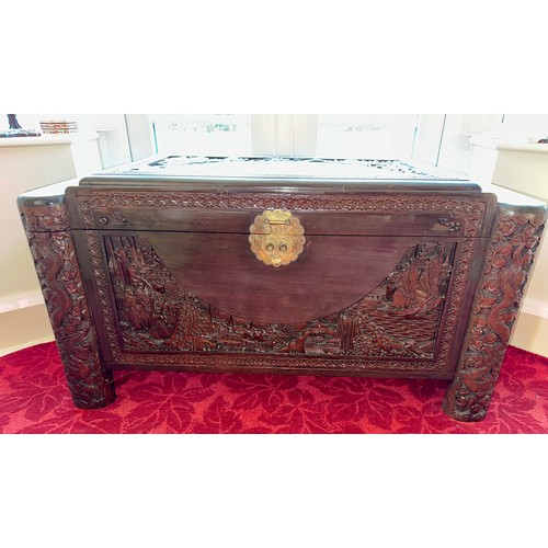 98 - A Chinese carved camphor wood chest with inner tray, with original lock. 104 w x 49 d x 56cm h.