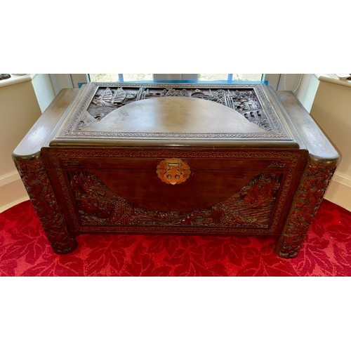 98 - A Chinese carved camphor wood chest with inner tray, with original lock. 104 w x 49 d x 56cm h.