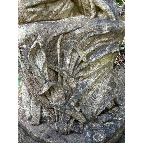 18 - A female statue in reconstituted stone. 65cm h.