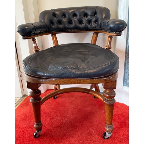 100 - A 19thC mahogany and leather upholstered armchair.