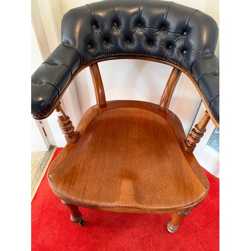 100 - A 19thC mahogany and leather upholstered armchair.