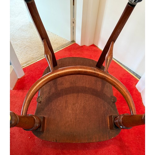 100 - A 19thC mahogany and leather upholstered armchair.