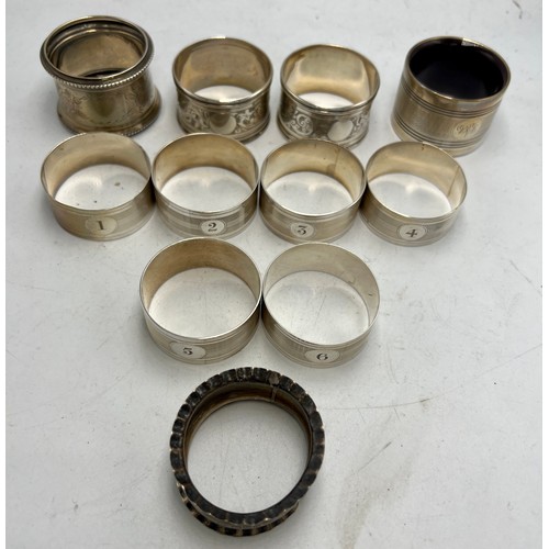 851 - Eleven various hallmarked silver napkin rings to include a set of six numbered 1-6. Various dates an... 